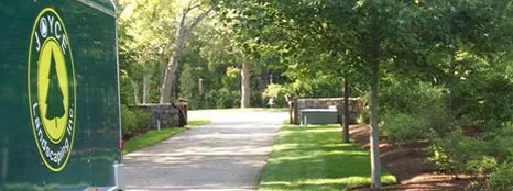 Joyce Landscaping truck beside a manicured lawn and driveway